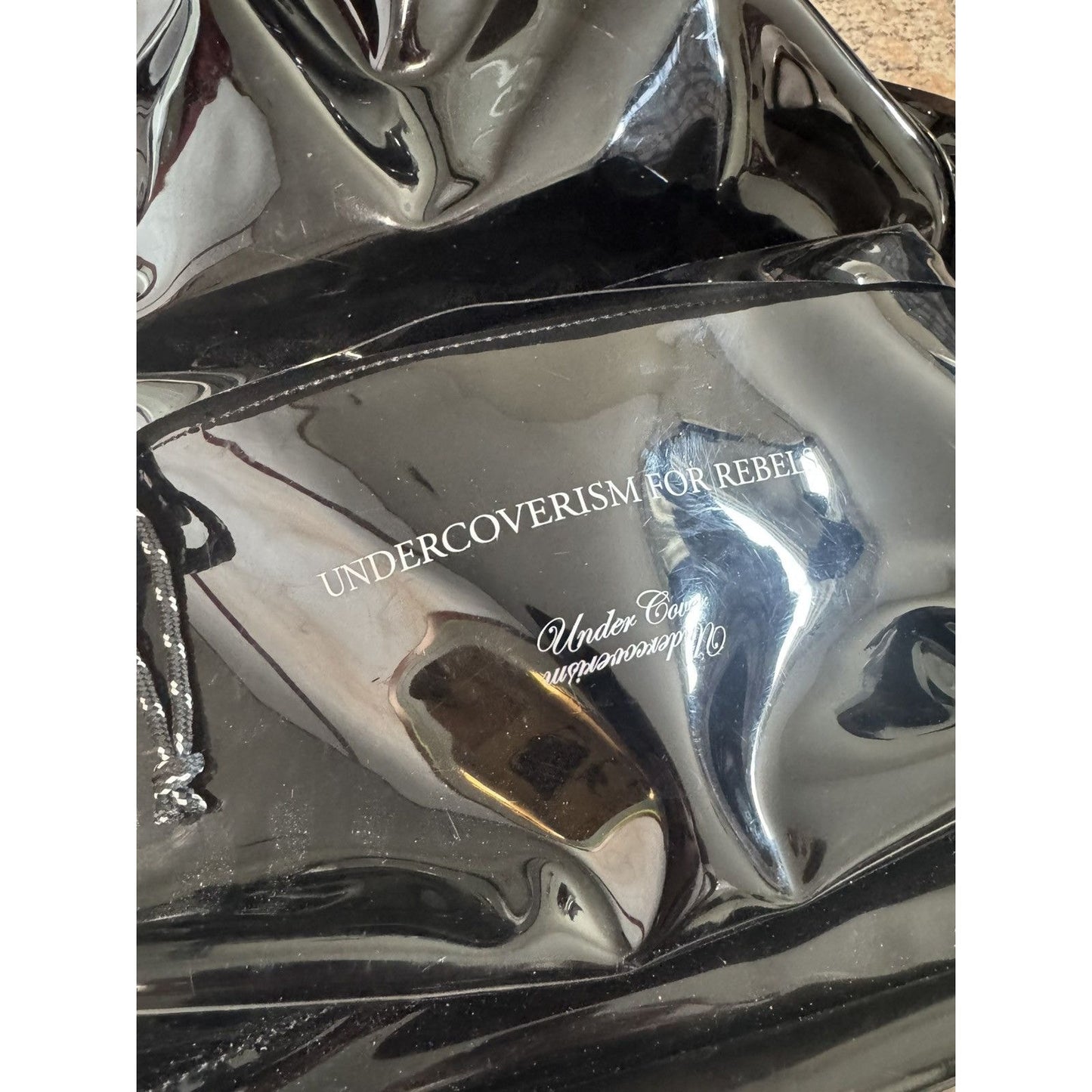 Undercover For Rebels PVC Bookbag